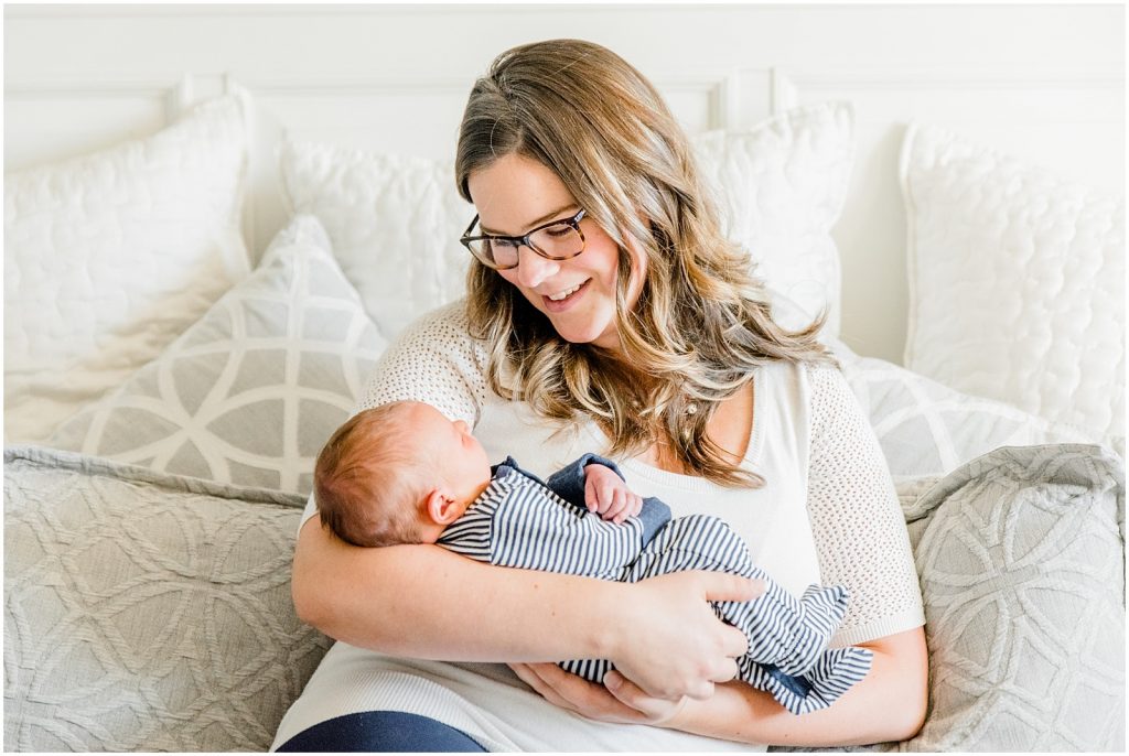 ancaster hamilton lifestyle newborn session baby with mom on bed