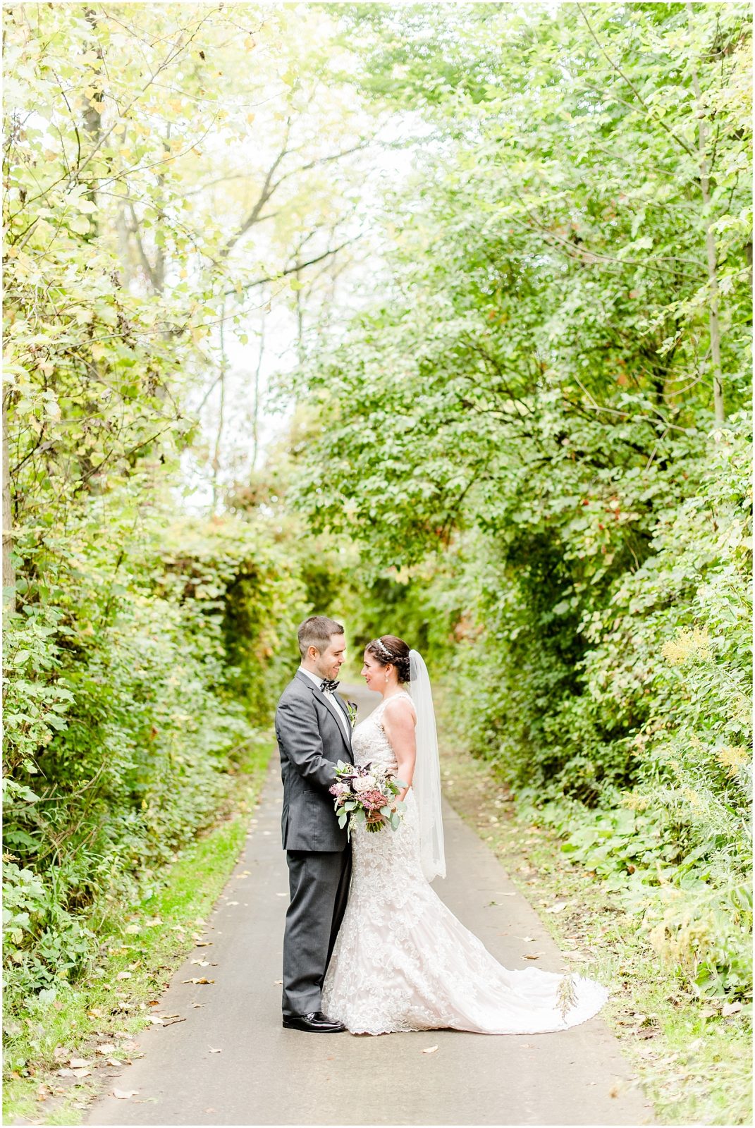 firerock golf course wedding bride and groom on path in middle of trees