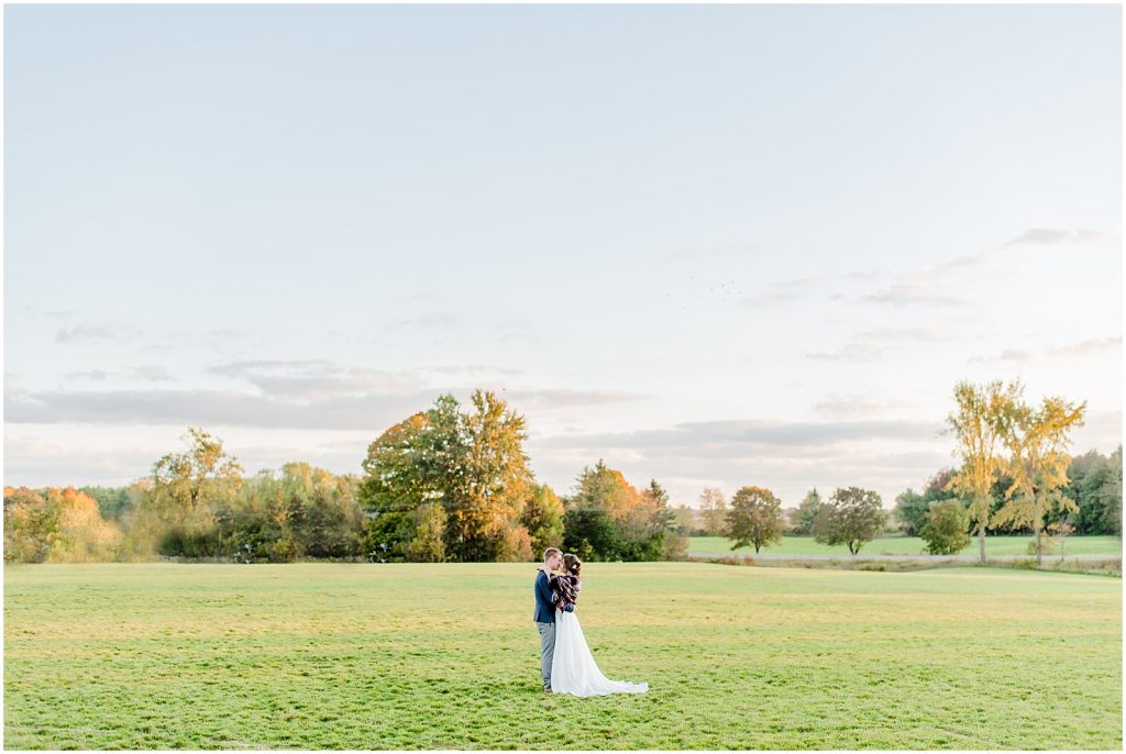 oxford country countryside wedding bride and groom at golden hour in field