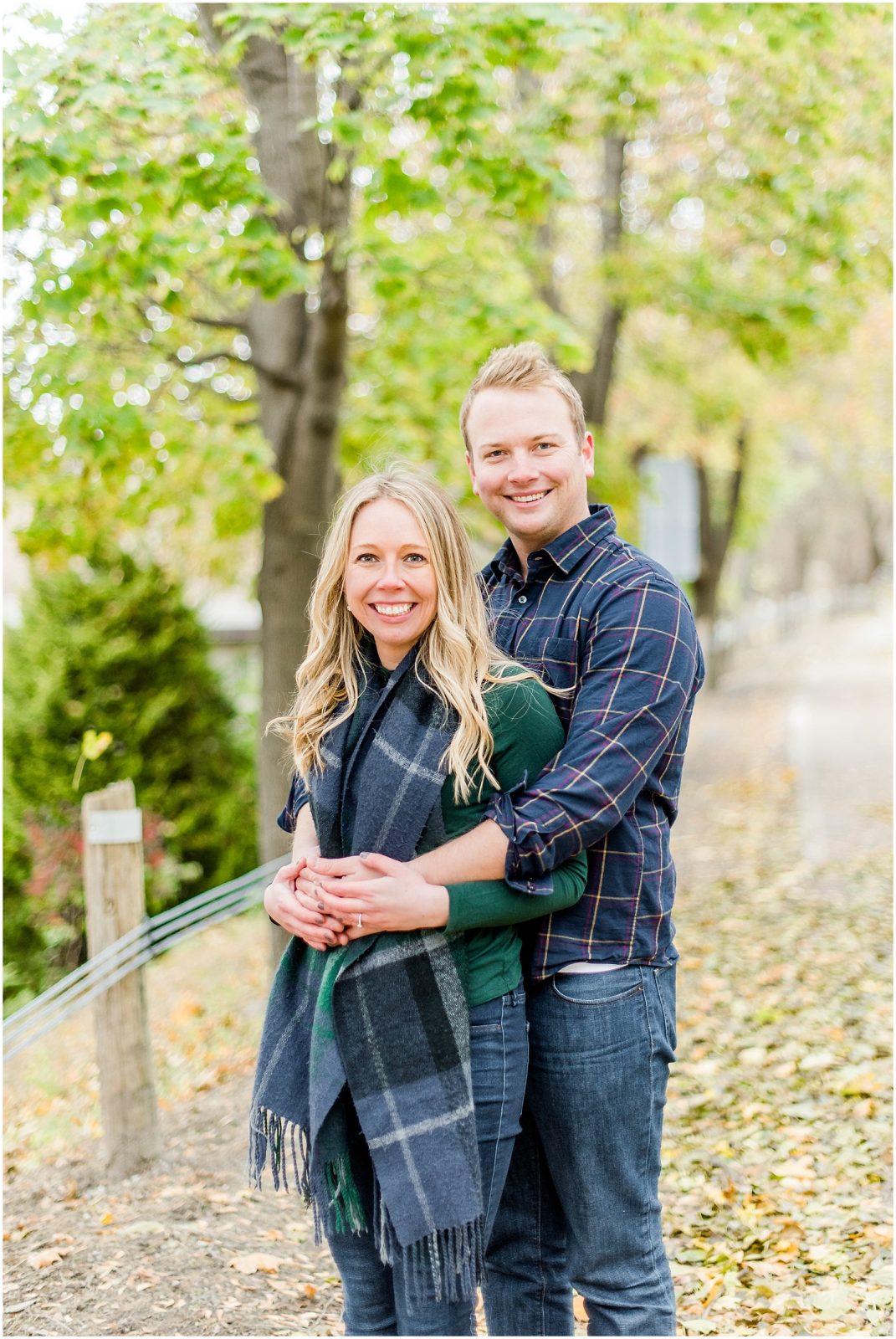 Lorne Park Brantford Engagement Session couple smiling in the fall leaves