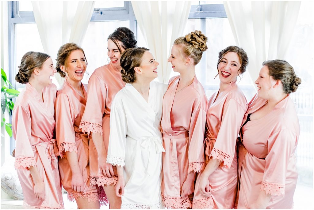 primp and proper salon vancouver wedding bride and bridesmaids in robes lauging