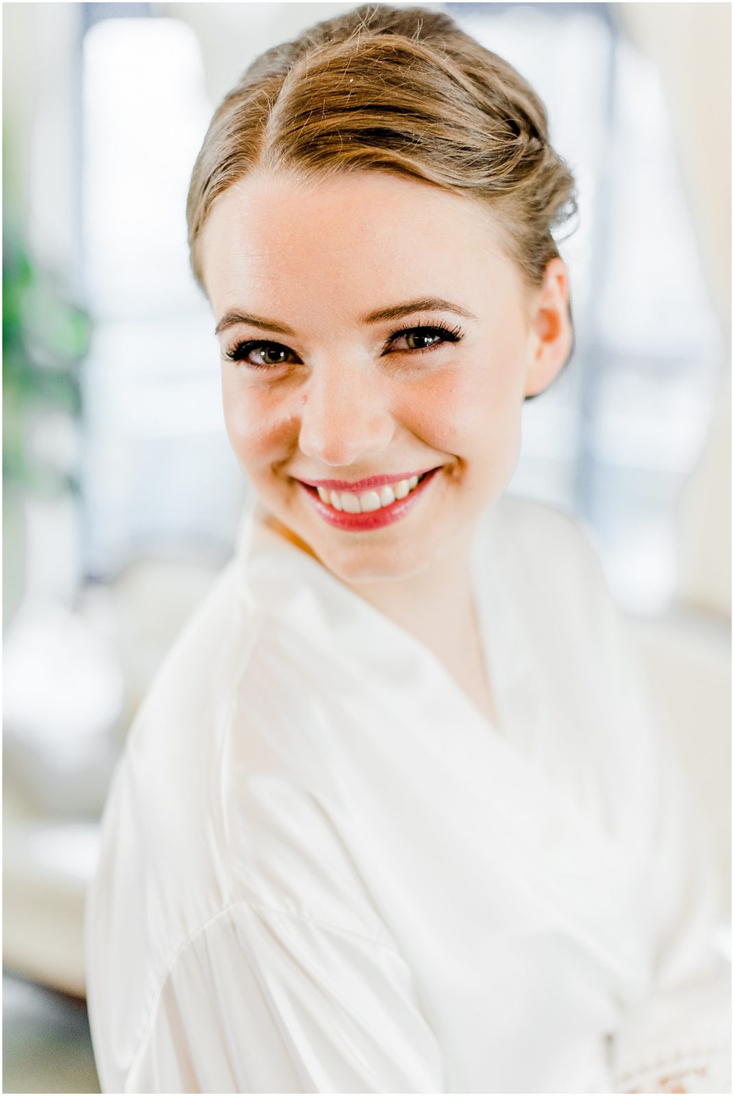 primp and proper salon vancouver wedding bride in robe hair and makeup