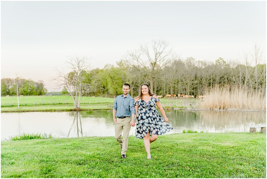 Burgessville Countryside Engagement Session Couple laughing by pond