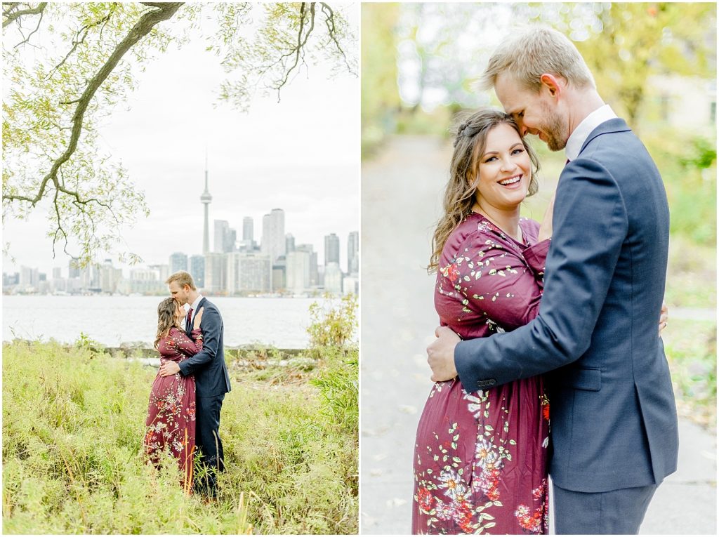 Toronto Island Engagement Session couple hugging in front of cityscape