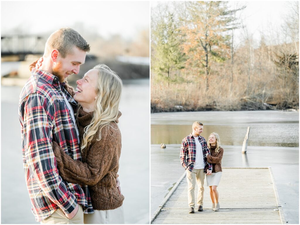 couple laughing with each other and snuggling close on a dock